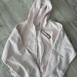 SKIMS Cotten fleece shrunken zip up hoodie in light pink 
SMALL New with tags
